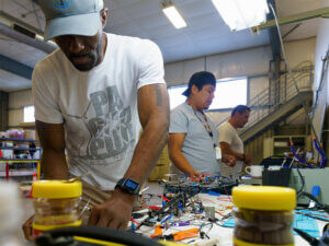 Men work at a bend in the hangar at Oregon UAS Accelerator