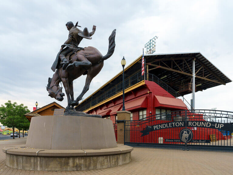 Statue of a man riding a saddle bronc at the Pendleton Round-Up grounds